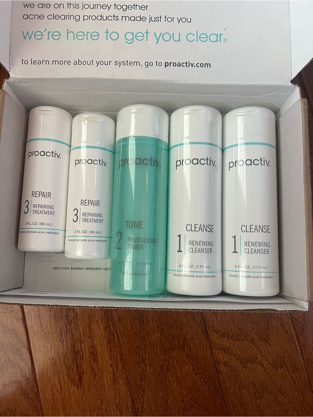 Proactiv Skincare Set in White & Aqua Bottles
